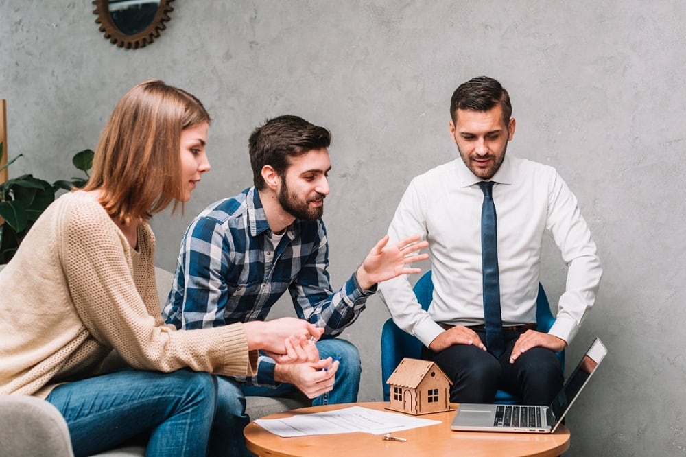 An advisory meeting about a home for a relocated employee